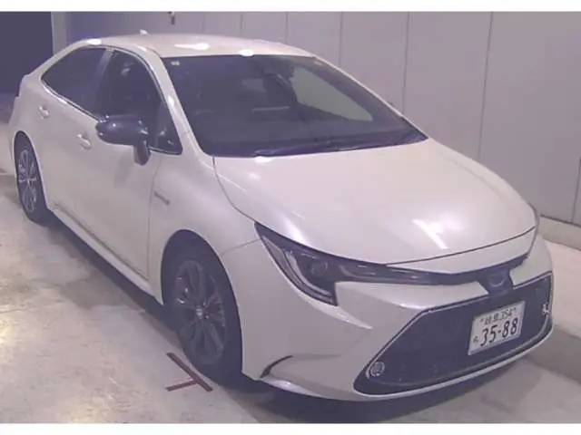 2020 Toyota Corolla Hybrid W×B - photo 1 2020 Toyota Corolla Hybrid W×B Pearl Sedan for sale, Japanese used car export - photo 1 of 3 | GULJI TRADERS