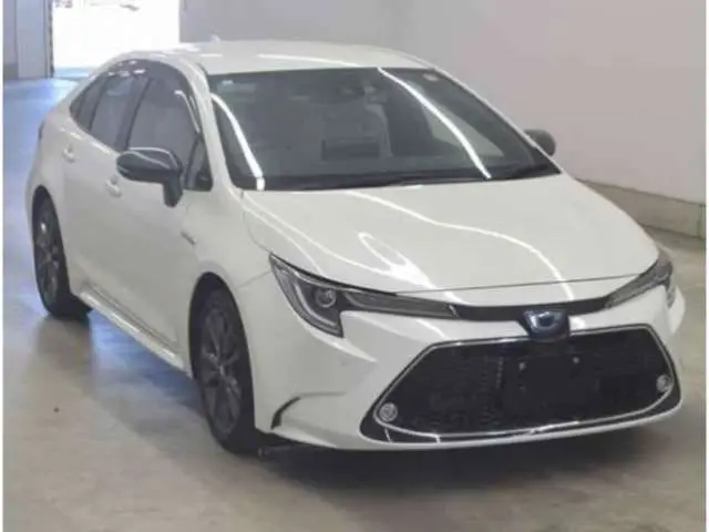 2020 Toyota Corolla Hybrid WxB - photo 1 2020 Toyota Corolla Hybrid WxB Pearl Sedan for sale, Japanese used car export - photo 1 of 3 | GULJI TRADERS