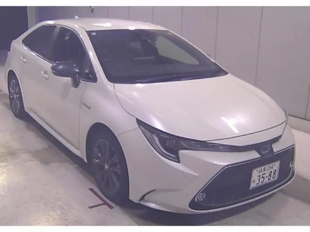 2020 Toyota Corolla Hybrid Double By - photo 1 2020 Toyota Corolla Hybrid Double By Pearl Sedan for sale, Japanese used car export - photo 1 of 3 | GULJI TRADERS
