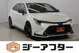 2021 Toyota Corolla 1.8 HYBRID WxB 4WD White Sedan for sale, Japanese used car export - photo 1 of 29 | GULJI TRADERS
