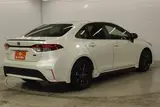 2021 Toyota Corolla 1.8 HYBRID WxB 4WD White Sedan for sale, Japanese used car export - photo 5 of 29 | GULJI TRADERS
