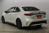 2021 Toyota Corolla 1.8 HYBRID WxB 4WD White Sedan for sale, Japanese used car export - photo 7 of 29 | GULJI TRADERS