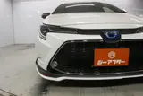 2021 Toyota Corolla 1.8 HYBRID WxB 4WD White Sedan for sale, Japanese used car export - photo 10 of 29 | GULJI TRADERS