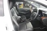 2021 Toyota Corolla 1.8 HYBRID WxB 4WD White Sedan for sale, Japanese used car export - photo 28 of 29 | GULJI TRADERS