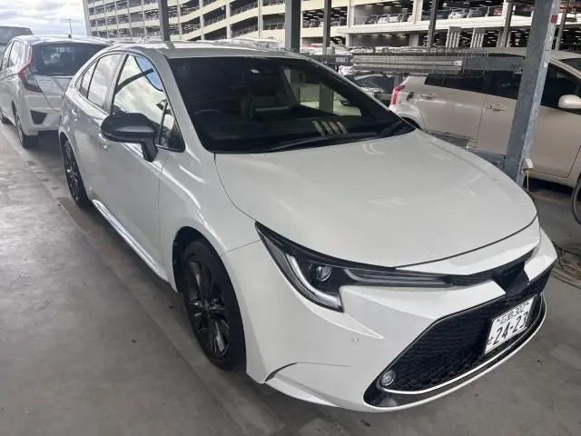 2021 Toyota Corolla Hybrid Double By - photo 1 2021 Toyota Corolla Hybrid Double By Pearl Sedan for sale, Japanese used car export - photo 1 of 3 | GULJI TRADERS