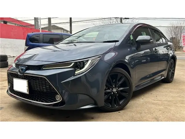 2022 Toyota Corolla 1.8 Hybrid WxB 50 Million Edition - photo 1 2022 Toyota Corolla 1.8 Hybrid WxB 50 Million Edition Gray Sedan for sale, Japanese used car export - photo 1 of 38 | GULJI TRADERS