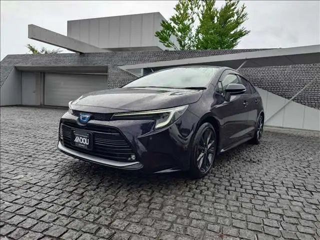 2023 Toyota Corolla Hybrid W×B 4WD Black Sedan for sale, Japanese used car export - photo 1 of 20 | GULJI TRADERS