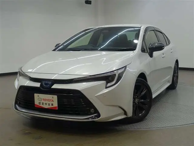 2023 Toyota Corolla 1.8 Hybrid WxB - photo 1 2023 Toyota Corolla 1.8 Hybrid WxB Pearl Sedan for sale, Japanese used car export - photo 1 of 33 | GULJI TRADERS