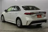 2023 Toyota Corolla 1.8 HYBRID X White Sedan for sale, Japanese used car export - photo 7 of 30 | GULJI TRADERS