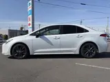 2023 Toyota Corolla Hybrid Double By White Sedan for sale, Japanese used car export - photo 2 of 9 | GULJI TRADERS