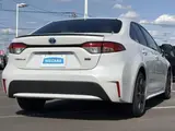 2023 Toyota Corolla Hybrid Double By White Sedan for sale, Japanese used car export - photo 3 of 9 | GULJI TRADERS