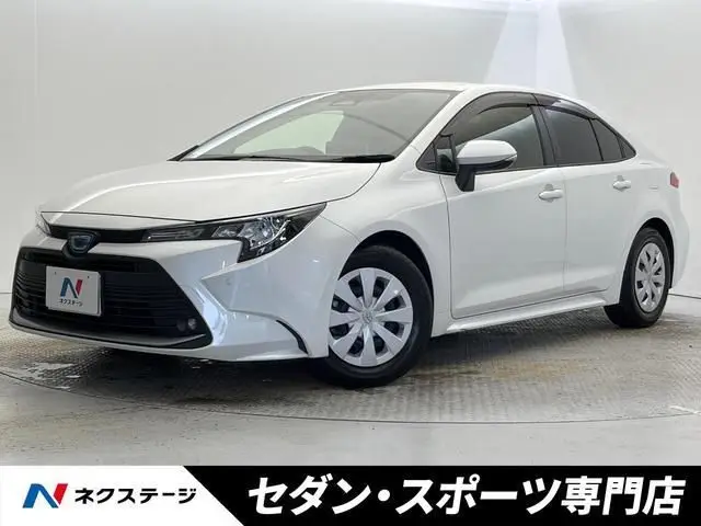 2023 Toyota Corolla Hybrid G White Sedan for sale, Japanese used car export - photo 1 of 9 | GULJI TRADERS