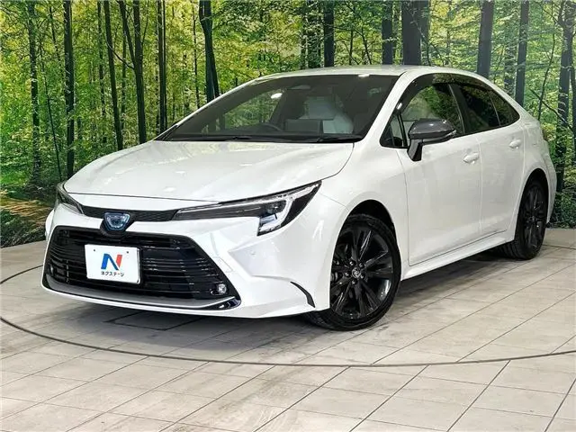 2024 Toyota Corolla Hybrid Double By - photo 1 2024 Toyota Corolla Hybrid Double By Pearl Sedan for sale, Japanese used car export - photo 1 of 29 | GULJI TRADERS