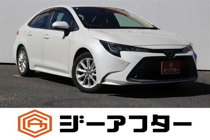 2024 Toyota Corolla 1.8 HYBRID G - photo 1 2024 Toyota Corolla 1.8 HYBRID G White Sedan for sale, Japanese used car export - photo 1 of 30 | GULJI TRADERS