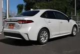 2024 Toyota Corolla 1.8 HYBRID G White Sedan for sale, Japanese used car export - photo 5 of 30 | GULJI TRADERS