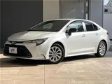 2025 Toyota Corolla Hybrid G Pearl Sedan for sale, Japanese used car export - photo 1 of 30 | GULJI TRADERS
