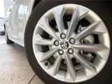 2025 Toyota Corolla Hybrid G Pearl Sedan for sale, Japanese used car export - photo 23 of 30 | GULJI TRADERS