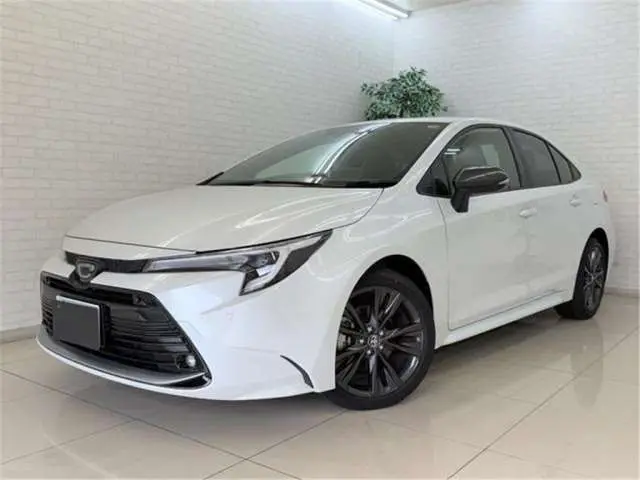 2025 Toyota Corolla Hybrid Double By - photo 1 2025 Toyota Corolla Hybrid Double By Pearl Sedan for sale, Japanese used car export - photo 1 of 48 | GULJI TRADERS