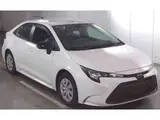 2025 Toyota Corolla Hybrid X (late model) White Sedan for sale, Japanese used car export - photo 1 of 9 | GULJI TRADERS