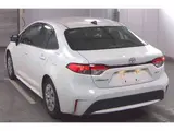 2025 Toyota Corolla Hybrid X (late model) White Sedan for sale, Japanese used car export - photo 2 of 9 | GULJI TRADERS