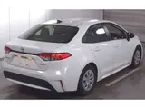 2025 Toyota Corolla Hybrid X (late model) White Sedan for sale, Japanese used car export - photo 4 of 9 | GULJI TRADERS