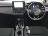 2025 Toyota Corolla Hybrid X (late model) White Sedan for sale, Japanese used car export - photo 5 of 9 | GULJI TRADERS