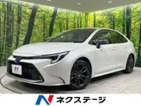 2025 Toyota Corolla Hybrid Double By White Sedan for sale, Japanese used car export - photo 1 of 9 | GULJI TRADERS