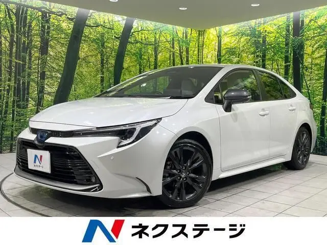 2025 Toyota Corolla Hybrid Double By White Sedan for sale, Japanese used car export | GULJI TRADERS