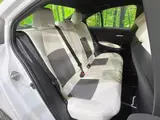 2025 Toyota Corolla Hybrid Double By White Sedan for sale, Japanese used car export - photo 9 of 9 | GULJI TRADERS