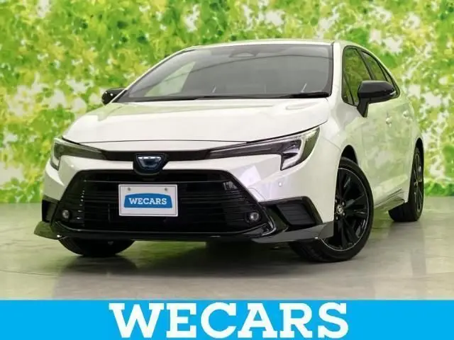 2025 Toyota Corolla Hybrid Active Sports White Sedan for sale, Japanese used car export | GULJI TRADERS