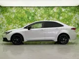 2025 Toyota Corolla Hybrid Active Sports White Sedan for sale, Japanese used car export - photo 2 of 9 | GULJI TRADERS