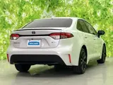 2025 Toyota Corolla Hybrid Active Sports White Sedan for sale, Japanese used car export - photo 3 of 9 | GULJI TRADERS