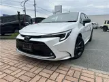 2026 Toyota Corolla 1.8 Hybrid WXB with rearview camera, ETC 2.0, and genuine front and rear dashcams. White Sedan for sale, Japanese used car export - photo 1 of 47 | GULJI TRADERS