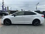 2026 Toyota Corolla 1.8 Hybrid WXB with rearview camera, ETC 2.0, and genuine front and rear dashcams. White Sedan for sale, Japanese used car export - photo 8 of 47 | GULJI TRADERS