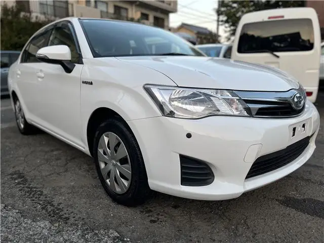 2015 Toyota Corolla Axio Hybrid HV White Sedan for sale, Japanese used car export - photo 1 of 55 | GULJI TRADERS