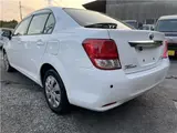 2015 Toyota Corolla Axio Hybrid HV White Sedan for sale, Japanese used car export - photo 2 of 55 | GULJI TRADERS