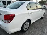 2015 Toyota Corolla Axio Hybrid HV White Sedan for sale, Japanese used car export - photo 13 of 55 | GULJI TRADERS