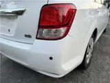 2015 Toyota Corolla Axio Hybrid HV White Sedan for sale, Japanese used car export - photo 14 of 55 | GULJI TRADERS