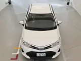 2019 Toyota Corolla Axio hybrid White Sedan for sale, Japanese used car export - photo 11 of 12 | GULJI TRADERS