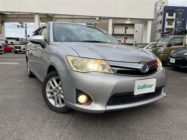 2013 Toyota Corolla Fielder Hybrid G - photo 1 2013 Toyota Corolla Fielder Hybrid G Sedan for sale, Japanese used car export - photo 1 of 22 | GULJI TRADERS