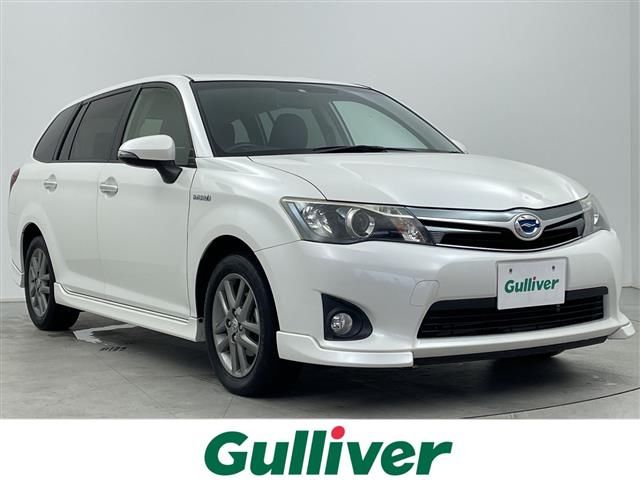 2013 Toyota Corolla Fielder HV G - photo 1 2013 Toyota Corolla Fielder HV G Sedan for sale, Japanese used car export - photo 1 of 24 | GULJI TRADERS