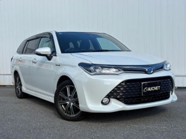 2015 Toyota Corolla Fielder 1.5 Hybrid G - photo 1 2015 Toyota Corolla Fielder 1.5 Hybrid G Sedan for sale, Japanese used car export - photo 1 of 9 | GULJI TRADERS