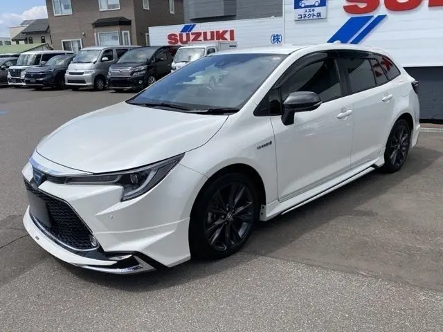 2020 Toyota Corolla Touring 1.8 Hybrid WxB E-Four 4WD - photo 1 2020 Toyota Corolla Touring 1.8 Hybrid WxB E-Four 4WD Pearl Van for sale, Japanese used car export - photo 1 of 51 | GULJI TRADERS