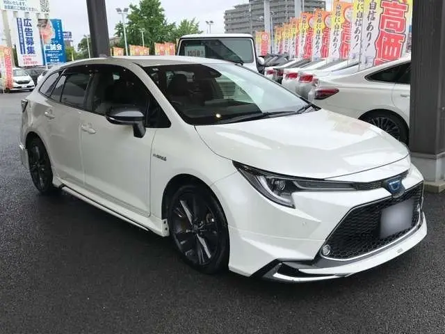 2020 Toyota Corolla Touring 1.8 Hybrid WxB - photo 1 2020 Toyota Corolla Touring 1.8 Hybrid WxB Pearl Van for sale, Japanese used car export - photo 1 of 29 | GULJI TRADERS
