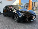 2020 Toyota Corolla Touring HYBRID WXB ★ 9-inch DA ★ BSM ★ HUD ★ Seat Heater Black Van for sale, Japanese used car export - photo 28 of 50 | GULJI TRADERS