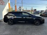 2020 Toyota Corolla Touring HYBRID WXB ★ 9-inch DA ★ BSM ★ HUD ★ Seat Heater Black Van for sale, Japanese used car export - photo 31 of 50 | GULJI TRADERS