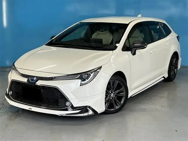 2020 Toyota Corolla Touring 1.8 HYBRID WxB - photo 1 2020 Toyota Corolla Touring 1.8 HYBRID WxB Pearl Van for sale, Japanese used car export - photo 1 of 30 | GULJI TRADERS