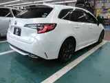 2020 Toyota Corolla Touring HYBRIDW×B 2WD Pearl Van for sale, Japanese used car export - photo 2 of 3 | GULJI TRADERS