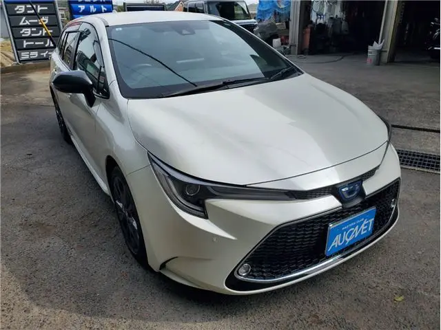 2021 Toyota Corolla Touring Hybrid Double B - photo 1 2021 Toyota Corolla Touring Hybrid Double B Pearl Van for sale, Japanese used car export - photo 1 of 53 | GULJI TRADERS