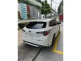 2021 Toyota Corolla Touring Hybrid WXB Pearl Van for sale, Japanese used car export - photo 2 of 16 | GULJI TRADERS